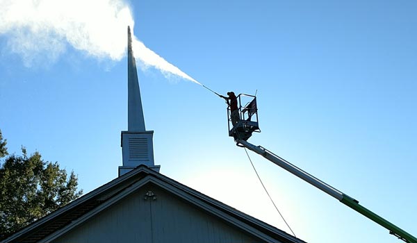 Alpharetta Pressure Washing worker cleaning chimney
